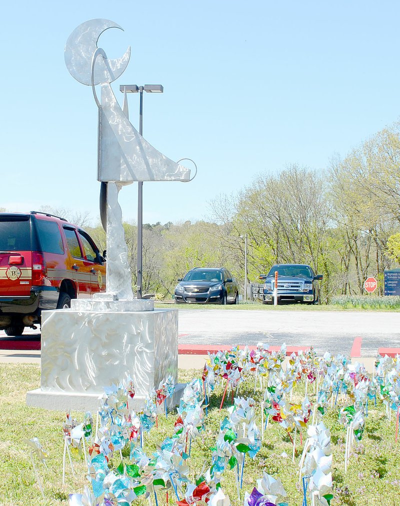 NWA Democrat-Gazette/Keith Bryant Marilyn Monroe, sculpted by St. Louis-based artist Larry Pogue, shimmers in the sunlight on a concrete pedestal in front of the Bella Vista police and fire departments. Pogue describes the piece as "what the metal told me to make."