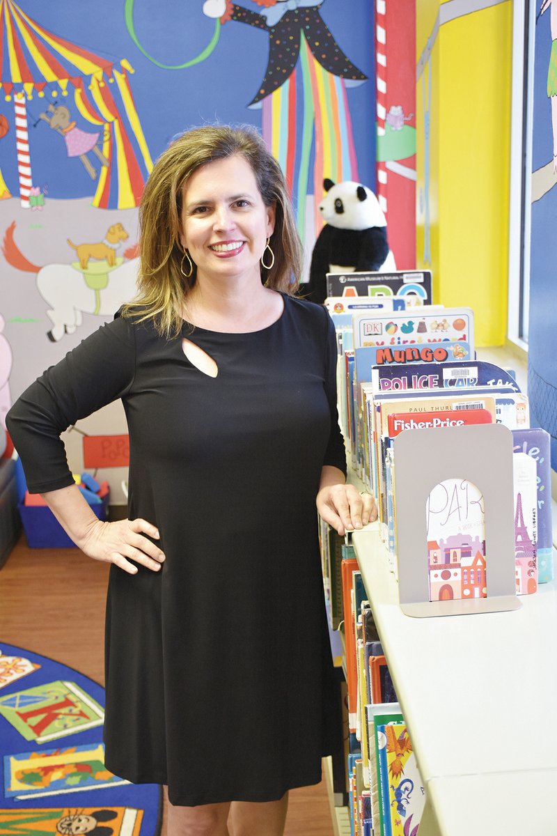 Jennifer Ballard, new director of the Jackson County/W.A. Billingsley Memorial Library in Newport, stands in the children’s area. Ballard, who previously worked in the Arkansas State University-Newport library and as children’s director of the Rogers Public Library, said growing the tween and teen program is one of her goals.