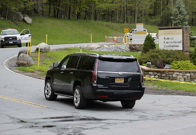 An SUV carrying Michael Cohen, President Donald Trump’s former personal attorney, arrives at the Federal Correctional Institution in Otisville, N.Y., on Monday. 