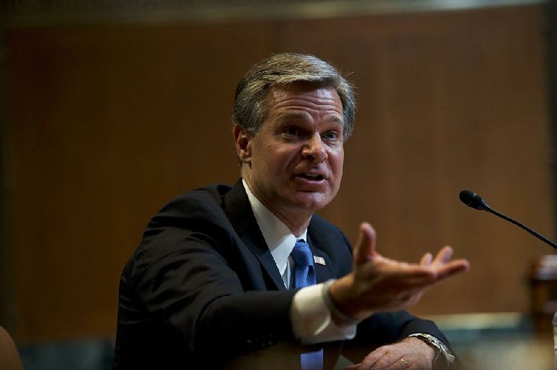 FBI Director Christopher Wray told senators Tuesday that his agency “is engaged in investigative activity” that includes surveillance, but he said “the key question is making sure that it’s done by the book.” 