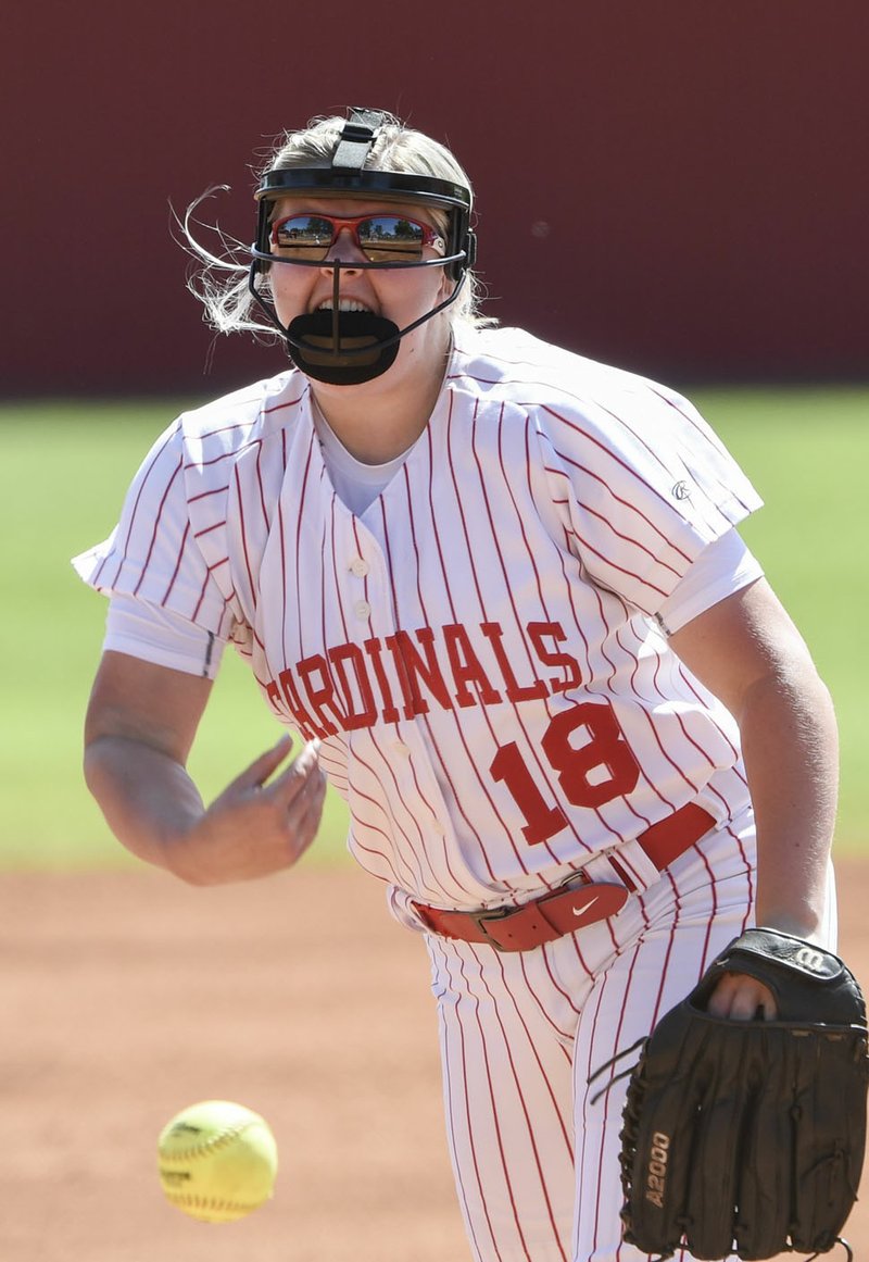 NWA Democrat-Gazette/CHARLIE KAIJO Farmington High School's McKenzi Bogan (18) throws a pitch during the 4A North Regional Softball Tournament, Sunday, May 5, 2019, at the Farmington softball field in Farmington.