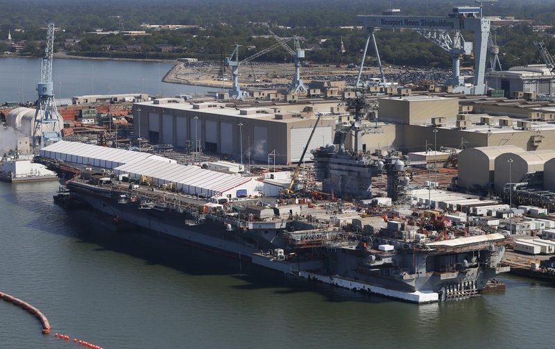 This April 27, 2016, file photo, shows the nuclear powered aircraft carrier USS Abraham Lincoln at Newport News Shipbuilding in Newport News, Va. The U.S. is dispatching the USS Abraham Lincoln and other military resources to the Middle East following "clear indications" that Iran and its proxy forces were preparing to possibly attack U.S. forces in the region, according to a defense official on May 5, 2019. (AP Photo/Steve Helber, File)