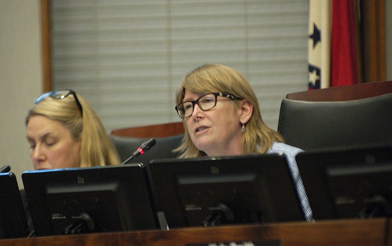 NWA Democrat-Gazette/STACY RYBURN Teresa Turk (right), Fayetteville City Council member, speaks Tuesda during a council meeting at City Hall. The council considered a proposal to bar the city from buying products made of expanded polystyrene foam but left the item on its second reading.