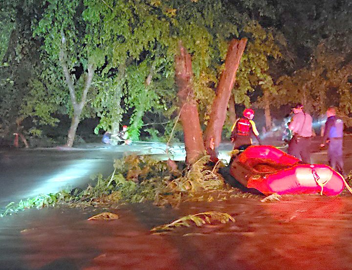 Photo by Bella Vista Fire Department
According to a Bella Vista Fire Department Facebook post, four members of the department's swift-water rescue team assisted McDonald County Sheriff’s Office with a water rescue overnight. A driver attempted to cross a flooded low-water bridge on Little Missouri Road in Pineville and the water swept his truck into Missouri Creek. Responders were delayed to the scene after they encountered a flooded road and had to backtrack and go a different route. When they arrived, the man was clinging to a tree in the rushing water of the flooded creek. The vehicle was nowhere in sight. 