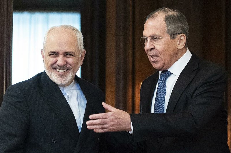 Iranian Foreign Minister Mohammad Javad Zarif (left) and Russian Foreign Minister Sergey Lavrov meet Wednesday in Moscow regarding Iran’s shift on its nuclear agreement. A Kremlin spokesman said President Donald Trump’s administration’s “poorly conceived, reckless decisions” have led Iran to curtail its commitments. 