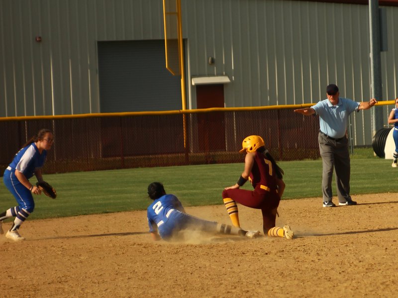 The Sentinel-Record/James Leigh FLEET FEET: Lake Hamilton senior Lanette Snyder (7) steals second as Sylvan Hills second baseman Alyssa Johnson (2) grabs the ball in the second inning of Tuesday's game. The Lady Wolves won, 6-0.