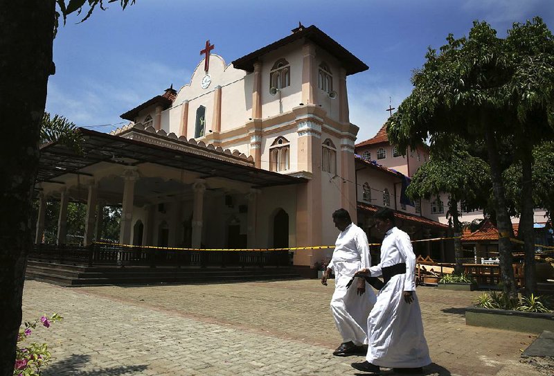 Sri Lankan Roman Catholic priests walk past damaged St. Sebastian’s Church in Katuwapitiya village in Negombo, north of Sri Lanka’s capital city of Colombo. Christians in Sri Lanka belong to both its main ethnic groups, and that rare inclusiveness of a small religious minority could explain the measured calm that has been the response so far to the Easter attacks. But there’s widespread fear that more attacks could plunge Sri Lanka into the cycle of violence and retaliation that marked the bloody civil war that ended a decade ago. 