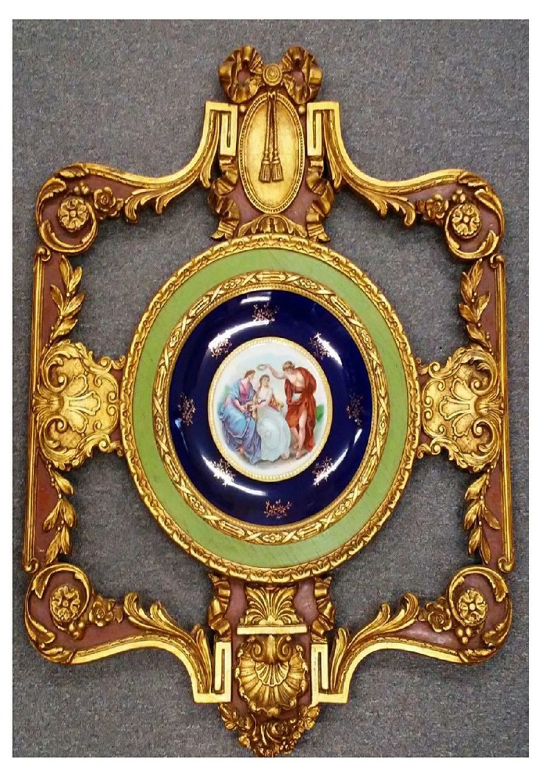 The unusual frame makes this piece interesting to collectors. 