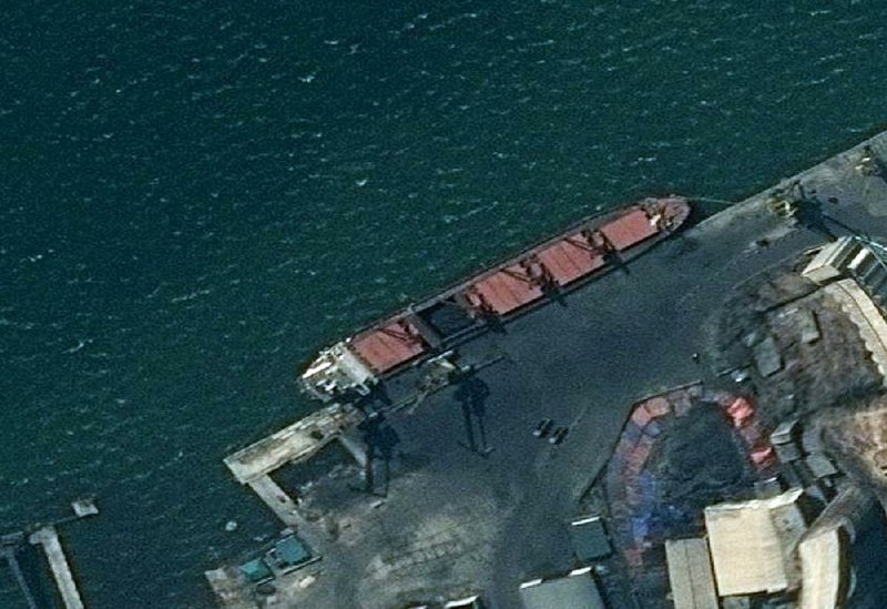 A satellite image released Thursday by the Department of Justice shows what officials say is a North Korean cargo ship at an un- specified port after it was seized by U.S. authorities for what they said was flouting sanctions by carrying banned coal exports. 