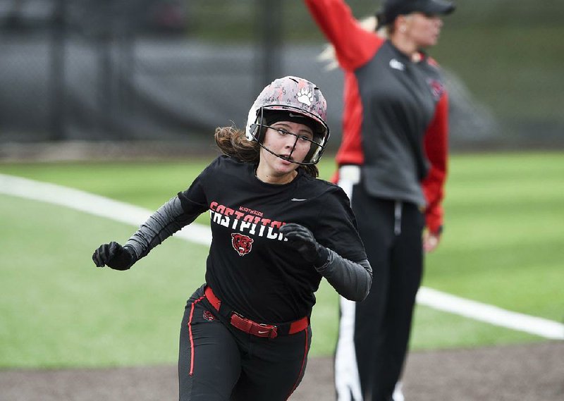 Fort Smith Northside’s Hannah Entrekin scores a run against Rogers Heritage during the opening round of the Class 6A state softball tournament Thursday in Bentonville. Northside won 8-6.