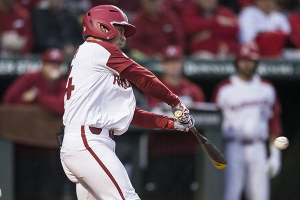 Arkansas center fielder Dominic Fletcher hits a home run during the third inning of a game against LSU on Thursday, May 9, 2019, in Fayetteville. 