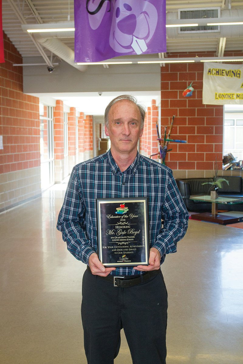 Gale Boyd, sixth-grade math teacher at Lonoke Middle School, holds his award for being named Educator of the Year by the Lonoke Area Chamber of Commerce. Boyd has taught at Lonoke for 28 years, having started his career at Lee County Schools in Marianna, where he taught for two years.