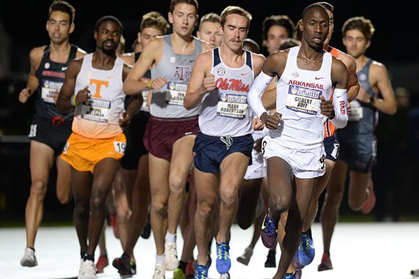 Arkansas' Gilbert Boit (right) leads the field Thursday, May 9, 2019, in the 10,000 meters during the SEC Outdoor Track and Field Championships at John McDonnell Field in Fayetteville. 
