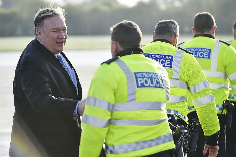 Secretary of State Mike Pompeo, shown greeting police officers as he prepared to leave London on Monday, will discuss “bilateral and multilateral challenges” facing the United States and Russia during his trip to Russia beginning Tuesday.