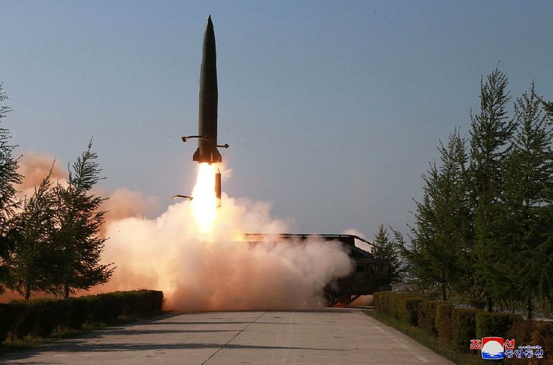 A missile blasts off Thursday along the west coast of North Korea in an image provided Friday by the North Korean government. 