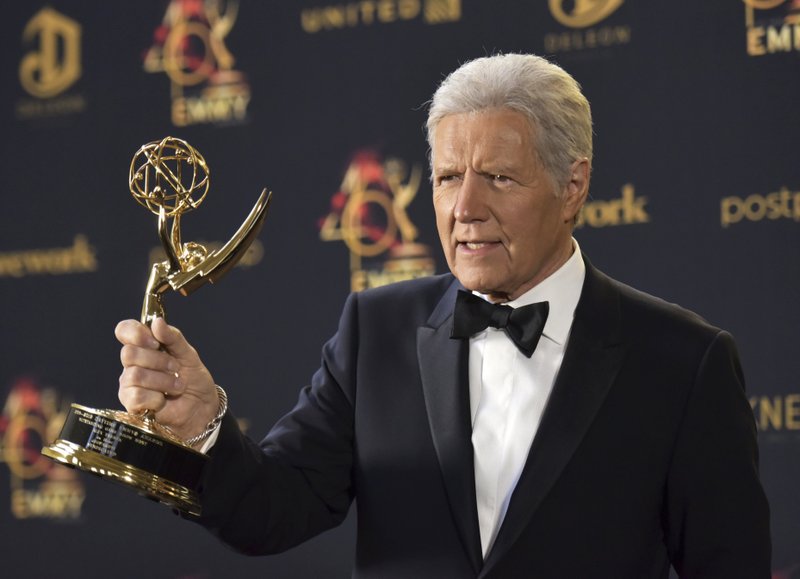 Alex Trebek poses in the press room with the award for outstanding game show host for "Jeopardy!" at the 46th annual Daytime Emmy Awards at the Pasadena Civic Center on Sunday, May 5, 2019, in Pasadena, Calif. 