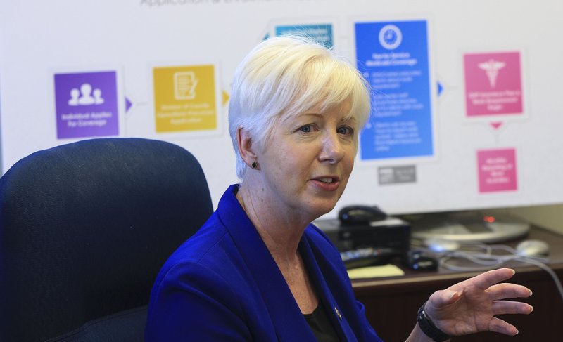 Department of Human Services Director Cindy Gillespie is shown speaking during a press conference in this photo.