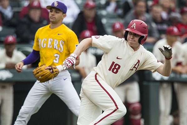 Arkansas' Heston Kjerstad retreats toward third base while caught in a rundown during a game against LSU on Saturday, May 11, 2019, in Fayetteville. 