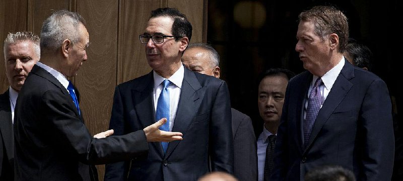 U.S. Treasury Secretary Steve Mnuchin (center) speaks with Chinese Vice Premier Liu He (left) as trade talks concluded Friday after only a few hours. Mnuchin called the talks “constructive.” story.lead_photo.caption