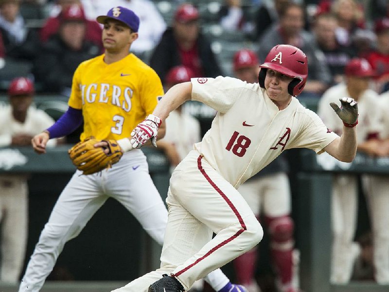 Arkansas right fielder Heston Kjerstad dashes back to third base to avoid getting caught in a rundown in the second inning against LSU on Saturday at Baum-Walker Stadium in Fayetteville. Kjerstad had two hits in the Razorbacks’ 3-2 loss.
