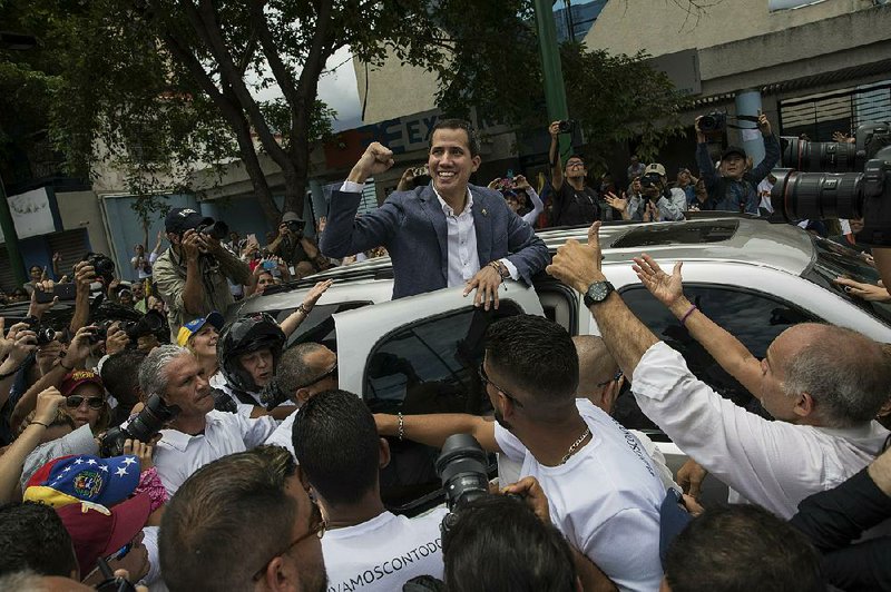 Venezuelan opposition leader Juan Guaido acknowledges supporters Saturday after speaking at a rally in Caracas.