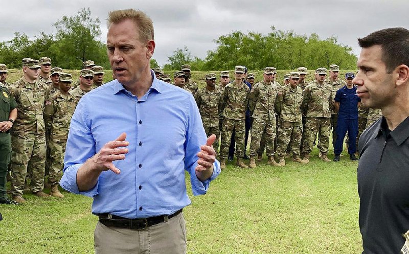 Acting Defense Secretary Patrick Shanahan, left, speaks with troops near McAllen, Texas, about the military's role in support of the Department of Homeland Security's effort to secure the border.