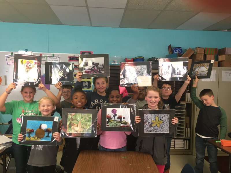 Prints: Junction City Elementary School students show their matted images.