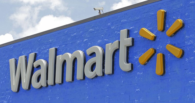 This June 1, 2017, file photo, shows a Walmart sign at a store in Hialeah Gardens, Fla. (AP Photo/Alan Diaz, File)