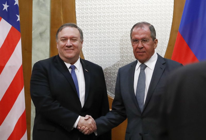 U.S. Secretary of State Mike Pompeo, left, and Russian Foreign Minister Sergey Lavrov pose for a photo prior to their talks in the Black Sea resort city of Sochi, southern Russia, Tuesday, May 14, 2019. Pompeo's first trip to Russia starts Tuesday in Sochi, where he and Russian Foreign Minister Sergey Lavrov are sitting down for talks and then having a joint meeting with President Vladimir Putin. (AP Photo/Pavel Golovkin, Pool)

