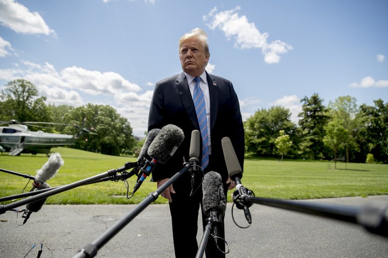 President Donald Trump listens to a question from a member of the media on the South Lawn of the White House in Washington, Tuesday, May 14, 2019, before boarding Marine One for a short trip to Andrews Air Force Base, Md., to travel to Louisiana. (AP Photo/Andrew Harnik)