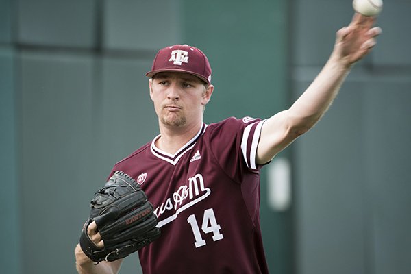 Texas A&M pitcher John Doxakis throws to a teammate before an NCAA college baseball game, Thursday, April 18, 2019, in Columbia, S.C. (AP Photo/Sean Rayford)