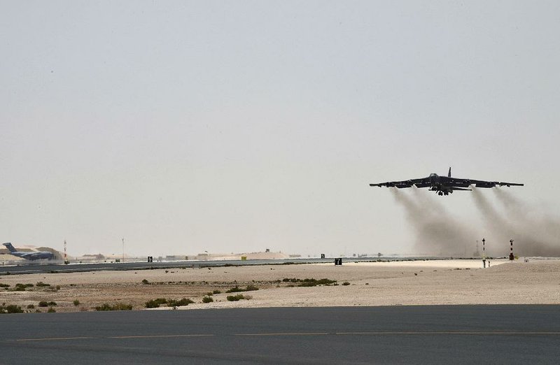 A U.S. B-52H takes off from an air base in Qatar on Sunday is this photo released by the Air Force. 