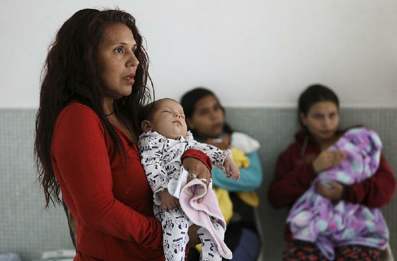 Arelys Pulido holds her 2-month-old daughter Zuleidys Antonella Primera while waiting to obtain the baby’s birth certificate at Erazmo Meoz hospital in Cucuta, on Colombia’s border with Venezuela, earlier this month. 