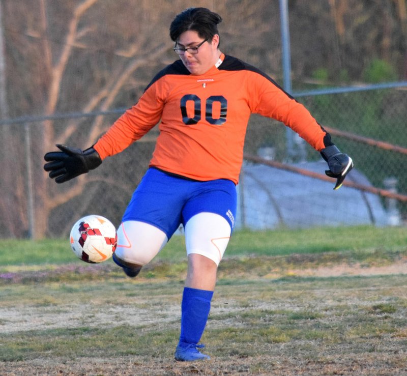 Westside Eagle Observer/MIKE ECKELS Lauro Molina, Bulldog goalkeeper, kicks the ball away from the net during the April 4 Decatur-Eureka Springs varsity boys' soccer match at Peterson Gym in Decatur. The Bulldogs finished the 2019 3A-1 regular season in second place behind Green Forest.