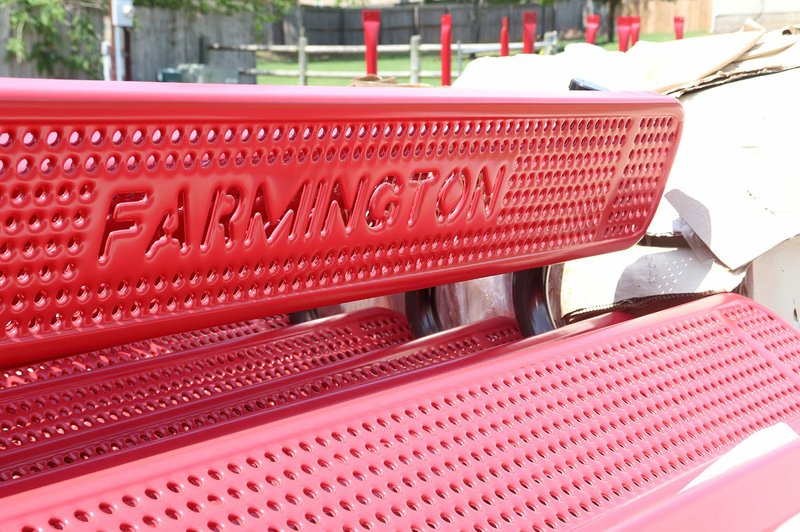 LYNN KUTTER ENTERPRISE-LEADER Benches, picnic tables and trash cans are piled in one area at Creekside Park, waiting to be installed in part of a $2 million expansion to the park.