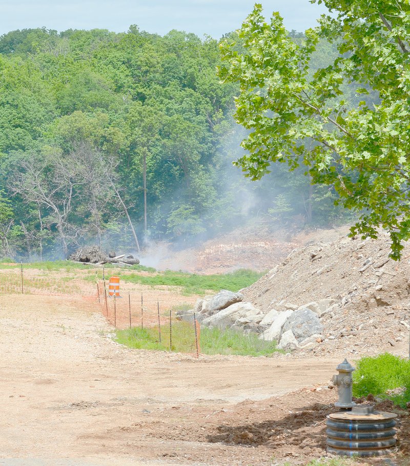 Keith Bryant/The Weekly Vista Smoke rises from the former stump dump site alongside Trafalgar Road. According to a timeline released by the POA, the fire is expected to be out by June 13, barring any delays.