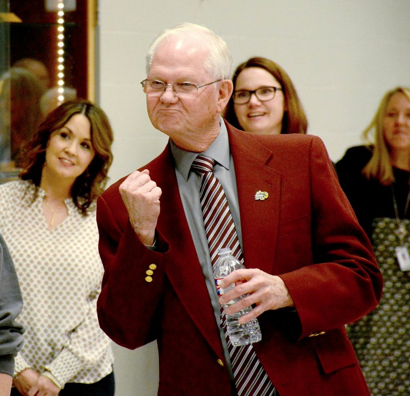 Janelle Jessen/Herald-Leader Superintendent Ken Ramey pumped his fist as the high school choir sang a personalized rendition of "Oh Happy Day"-- a phrase he is well known for using -- during his retirement party on Friday. Ramey announced in January his plans to retire at the end of the school year in June after a 52-year career in education. His party was attended by many current and former staff members, and included a slideshow and photo booth.