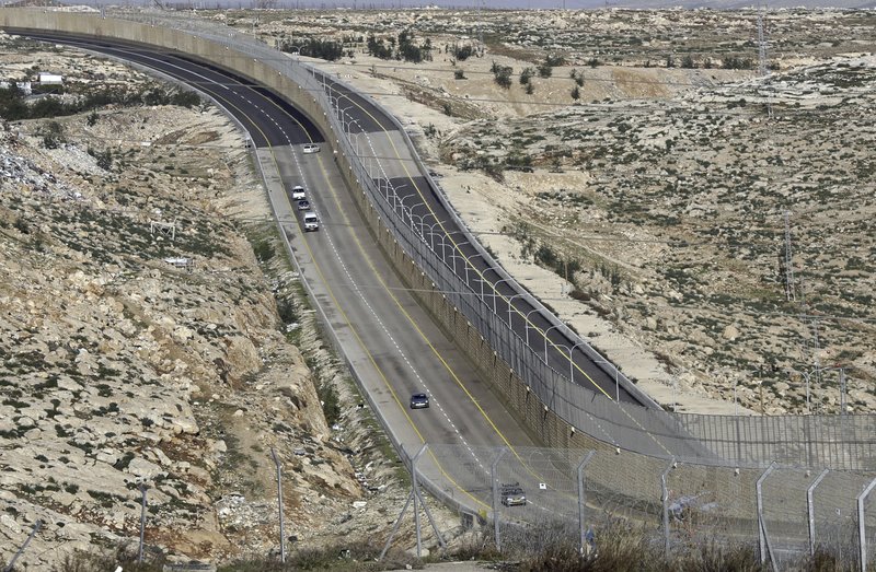 This Jan. 10, 2019 file photo, shows a newly opened segregated West Bank highway near Jerusalem. Israel's government went on a spending binge in its West Bank settlements following the election of President Donald Trump, according to official data obtained by The Associated Press.  (AP Photo/Mahmoud Illean, File)