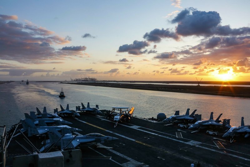 In this Thursday, May 9, 2019 photo released by the U.S. Navy, the Nimitz-class aircraft carrier USS Abraham Lincoln transits the Suez Canal in Egypt. The aircraft carrier and its strike group are deploying to the Persian Gulf on orders from the White House to respond to an unspecified threat from Iran. (Mass Communication Specialist Seaman Dan Snow, U.S. Navy via AP)

