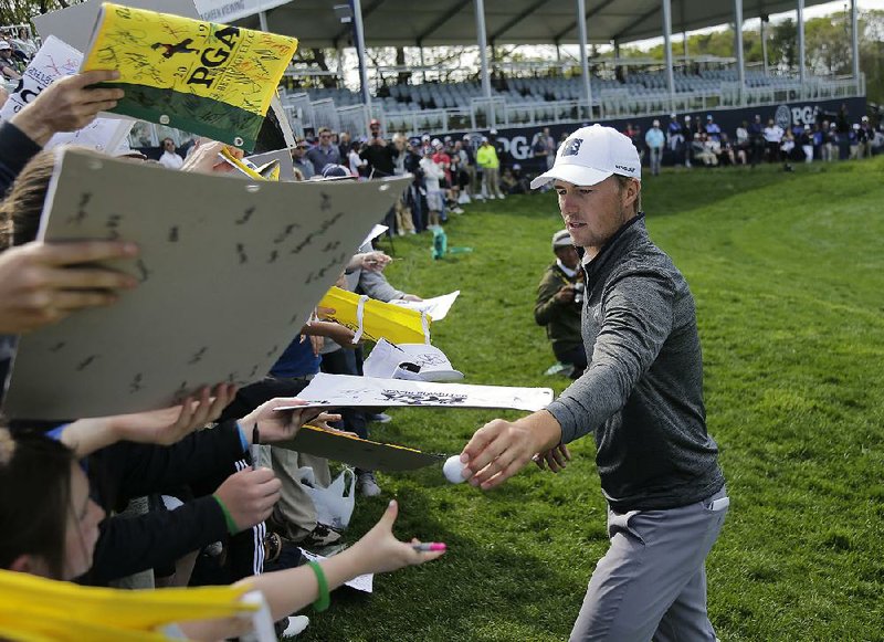Jordan Spieth signs autographs Wednesday after completing a practice round for the PGA Championship at Bethpage Black in Farmingdale, N.Y. Spieth is winless since getting the third leg of the career grand slam in the 2017 British Open. 