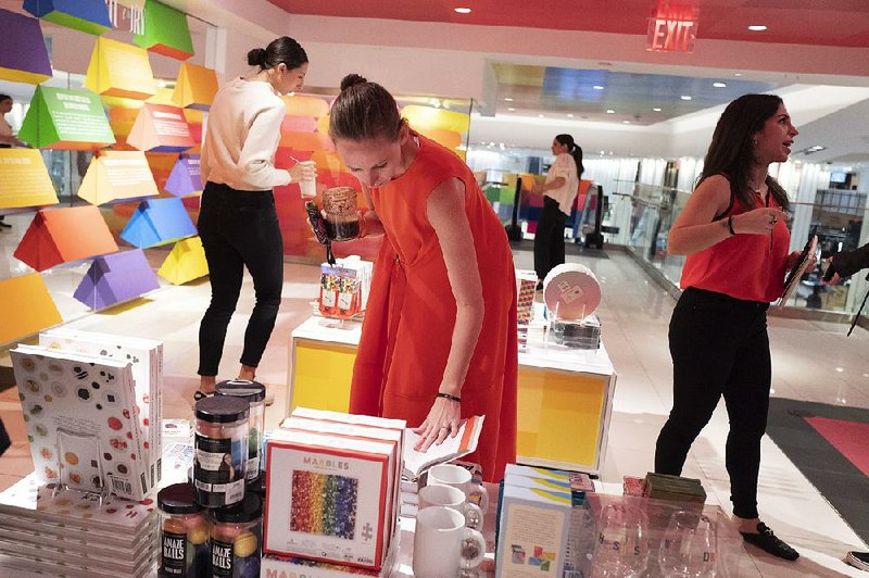 U.S. retail sales declined last month, led by a drop in spending by shoppers like these shown at the opening day in April of Story at Macy’s in New York. 