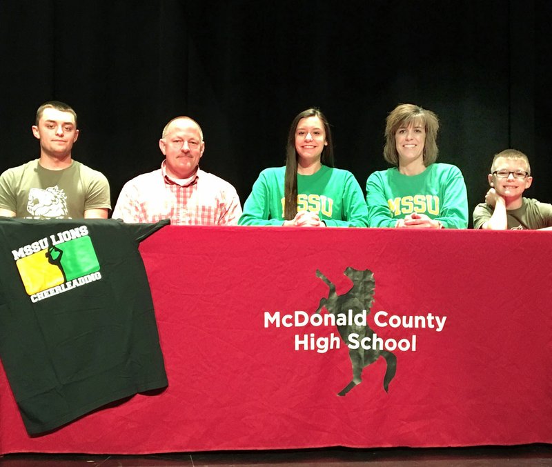 Courtesy Photo McDonald County High School cheerleader Bailey Barrett (center) recently signed to cheer next year at Missouri Southern State University. Shown above are (from left) Blake Barrett (brother), Brandon Barrett (dad), Bailey Barrett, Mandy Barrett (mom) and Bryer Barrett (brother).