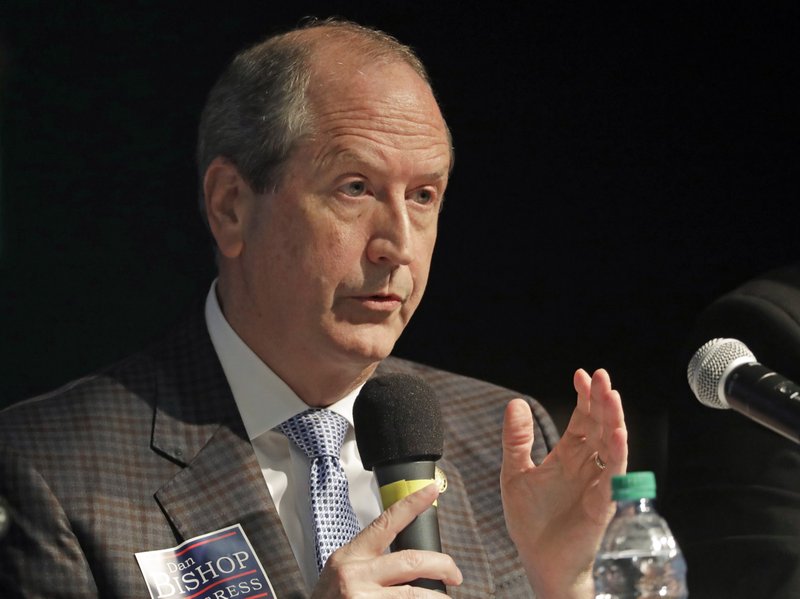  In this May 7, 2019, photo, Dan Bishop answers a question during a debate among Republican candidates for the 9th Congressional District, in Monroe, N.C.  (AP Photo/Chuck Burton)