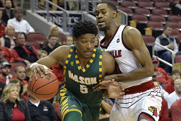 George Mason guard Jaire Grayer (5) attempts to drive past the defense of Louisville forward V.J. King (0) during the first half of an NCAA college basketball game, Sunday, Nov. 12, 2017, in Louisville, Ky. (AP Photo/Timothy D. Easley)
