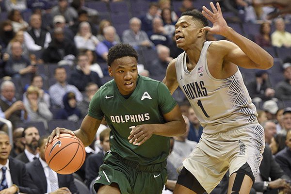 Jacksonville guard JD Notae, left, dribbles against Georgetown forward Jamorko Pickett, right, during the first half of an NCAA college basketball game, Sunday, Nov. 12, 2017, in Washington. (AP Photo/Nick Wass)

