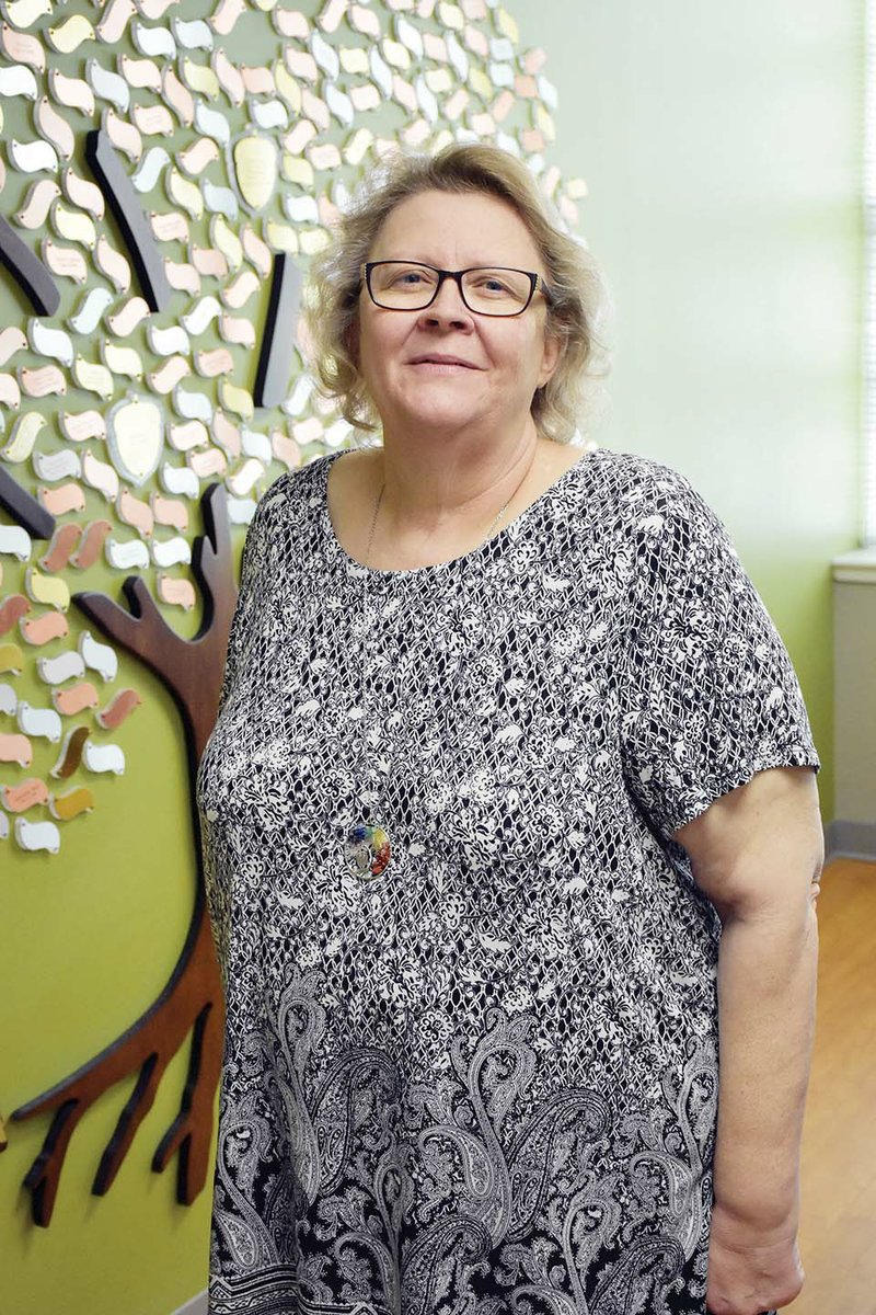 Miriam “Lanita” Addison, administrative specialist at the Norbert O. Schedler Honors College at the University of Central Arkansas in Conway, is the recipient of the 2019 National Collegiate Honors Council Award for Administrative Excellence. She is shown here in front of the college’s “giving tree,” which features names of donors to the college.