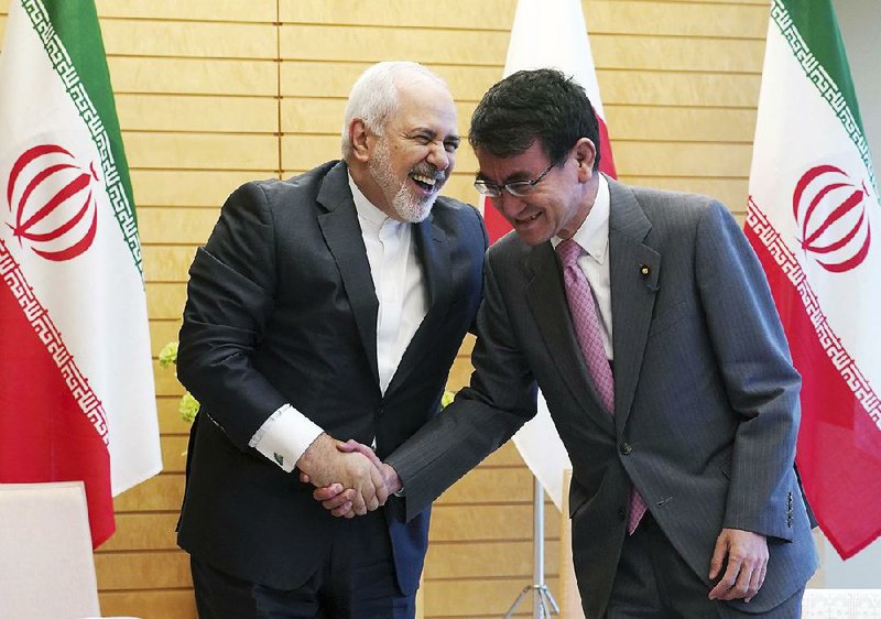 Iranian Foreign Minister Mohammad Javad Zarif (left) meets Thursday with Japanese counterpart Taro Kono in Tokyo. While there, Zarif dismissed the possibility of talks with President Donald Trump’s administration to ease tensions. “The escalation by the United States is unacceptable,” Zarif told reporters.