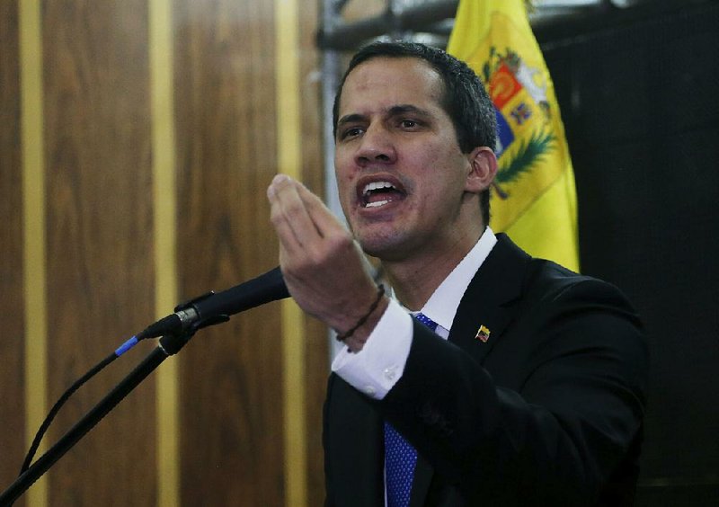 Venezuela’s opposition leader and self-proclaimed interim president Juan Guaido speaks Thursday at a meeting with the Chamber of Commerce in Caracas. 