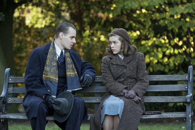 William Mitchell (Freddie Gaminara) lures the politically naive Joan Stanley (Sophie Cookson) into a web of intrigue in Red Joan. 