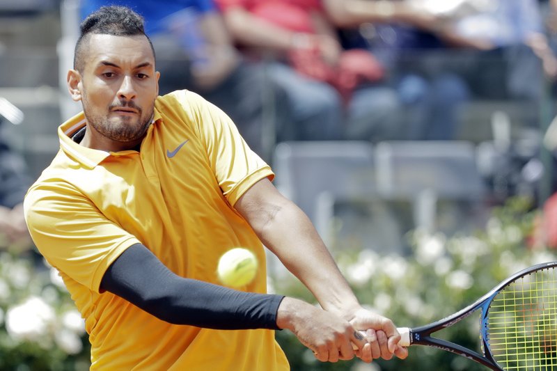 Nick Kyrgios of Australia returns the ball to Daniil Medvedev of Russia at the Italian Open tennis tournament, in Rome, Tuesday, May, 14, 2019. Kyrgios won 6-3, 3-6, 6-3. (AP Photo/Andrew Medichini)